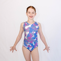 Girl wearing pink camo leotard with a white background