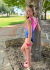 RSG-648 Chloe Barani sleeveless leotard. RS Gymwear Australia. Gymnast next to a tree in the park.